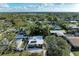 Aerial view of a single Gathering home with a flat roof and a yard at 3068 Courtland St, Sarasota, FL 34237