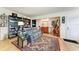 Living room with hardwood floors, gray couch, and built-in bookcase at 3068 Courtland St, Sarasota, FL 34237