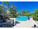 Refreshing community pool with surrounding patio and lounge chairs at 321 Sapphire Lake Dr # 101, Bradenton, FL 34209