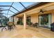 Large covered patio with seating areas and access to interior rooms at 340 Cedar Falls Dr, Apollo Beach, FL 33572