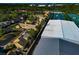 Aerial view showing residential homes adjacent to tennis courts at 3607 57Th Avenue W Dr, Bradenton, FL 34210