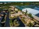 Aerial perspective of homes and tennis courts in a residential community at 3607 57Th Avenue W Dr, Bradenton, FL 34210