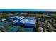 Aerial view of a community with multiple tennis courts and buildings at 3607 57Th Avenue W Dr, Bradenton, FL 34210