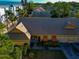 Top-down view of a tan house with tile roof and a neatly landscaped yard at 3607 57Th Avenue W Dr, Bradenton, FL 34210