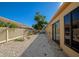 Backyard landscape with gravel and lattice fence at 3607 57Th Avenue W Dr, Bradenton, FL 34210