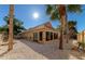 Backyard showcasing gravel, palm trees, and home exterior at 3607 57Th Avenue W Dr, Bradenton, FL 34210