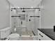 Modern bathroom with a large walk-in shower and pebble floor at 3607 57Th Avenue W Dr, Bradenton, FL 34210
