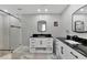 Stylish bathroom with a double vanity and large walk-in shower at 3607 57Th Avenue W Dr, Bradenton, FL 34210