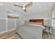 Spacious bedroom with king-size bed and large TV at 3607 57Th Avenue W Dr, Bradenton, FL 34210