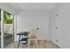 Small dining area with a table and chair, next to a sliding glass door at 3607 57Th Avenue W Dr, Bradenton, FL 34210