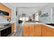 Open concept kitchen with island and stainless steel appliances at 3607 57Th Avenue W Dr, Bradenton, FL 34210