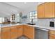 Kitchen features a large island and modern sink with a waterfall faucet at 3607 57Th Avenue W Dr, Bradenton, FL 34210