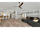 Open concept living room and kitchen with hardwood floors and modern decor at 3607 57Th Avenue W Dr, Bradenton, FL 34210