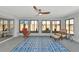 Relaxing sunroom with comfortable seating and patterned rug at 3607 57Th Avenue W Dr, Bradenton, FL 34210