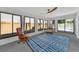Bright sunroom with wood furniture and access to backyard at 3607 57Th Avenue W Dr, Bradenton, FL 34210