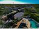 Community tennis court with pool and lounge chairs at 3607 57Th Avenue W Dr, Bradenton, FL 34210