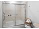Clean bathroom with tub/shower combo, and a wicker towel holder at 4204 126Th W St # 506, Cortez, FL 34215