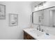 Clean bathroom with modern vanity and frameless mirror at 4204 126Th W St # 506, Cortez, FL 34215