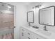 Updated bathroom with double vanity, modern light fixtures, and shower at 4204 126Th W St # 506, Cortez, FL 34215