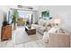 Living room with comfortable seating, large TV, and access to a balcony at 4204 126Th W St # 506, Cortez, FL 34215
