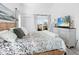 Relaxing main bedroom with king-size bed, dresser, and balcony access at 4204 126Th W St # 506, Cortez, FL 34215