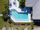 Aerial view of refreshing community pool with surrounding landscaping at 4204 126Th W St # 506, Cortez, FL 34215