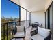 Relaxing screened balcony overlooking marina; includes comfortable seating at 4204 126Th W St # 506, Cortez, FL 34215