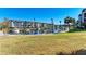 Community waterfront with boat docks and lush landscaping at 4370 Chatham Dr # 104, Longboat Key, FL 34228