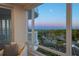 Living room with stunning sunset views from large windows at 455 Longboat Club Rd # 504, Longboat Key, FL 34228