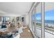 Bright living room with ocean views, hardwood floors, and comfortable seating at 455 Longboat Club Rd # 504, Longboat Key, FL 34228