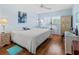 King-size bedroom with a ceiling fan and hardwood floors at 4736 Independence Dr # 4736, Bradenton, FL 34210