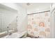 Bathroom with tub, shower, and colorful shower curtain at 4890 Laramie Cir, North Port, FL 34286