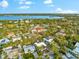 Aerial view showing the home's location in a residential area near water at 5019 Commonwealth Dr, Sarasota, FL 34242