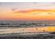 Orange sunset over calm ocean waves at 5019 Commonwealth Dr, Sarasota, FL 34242