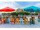 Colorful stools and umbrellas at a marina, providing a vibrant outdoor dining experience at 5019 Commonwealth Dr, Sarasota, FL 34242