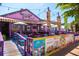 Exterior view of a whimsically designed fudge factory, with outdoor seating and colorful signage at 5019 Commonwealth Dr, Sarasota, FL 34242