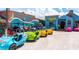Variety of brightly colored rental cars, lined up with the Tiki Bar, perfect for exploring the local area at 5019 Commonwealth Dr, Sarasota, FL 34242
