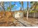 Small yellow storage shed nestled in a tropical backyard at 5019 Commonwealth Dr, Sarasota, FL 34242