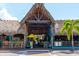 Inviting tiki bar featuring a rustic thatched roof, vibrant decor, and a lively outdoor setting at 5019 Commonwealth Dr, Sarasota, FL 34242