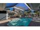 Screened pool and patio with outdoor dining table at 506 Treasure Boat Way, Sarasota, FL 34242