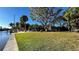 Canal-front property with grassy area and dock at 506 Treasure Boat Way, Sarasota, FL 34242