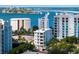 Luxury building near water with bridge and city views, showcasing desirable waterfront location at 509 Golden Gate Pt # 3, Sarasota, FL 34236