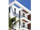 Modern building detail, showing unique architectural features with wood accents at 509 Golden Gate Pt # 3, Sarasota, FL 34236