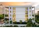 Multi-level building with clean lines, large windows and a bright exterior, showing modern architecture at 509 Golden Gate Pt # 3, Sarasota, FL 34236