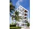 Stylish building with clean lines and palm trees, showcasing contemporary design at 509 Golden Gate Pt # 3, Sarasota, FL 34236