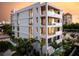 Contemporary building with multiple levels, balconies, and a pool, offering stunning views at 509 Golden Gate Pt # 3, Sarasota, FL 34236