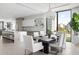 Open concept kitchen with modern appliances, a large island, and dining area at 509 Golden Gate Pt # 3, Sarasota, FL 34236