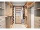 Large walk-in closet with ample shelving and hanging space at 509 Golden Gate Pt # 3, Sarasota, FL 34236