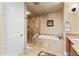 Spa-like bathroom with a large walk-in shower and soaking tub at 5209 Manorwood Dr # 3A, Sarasota, FL 34235