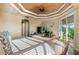 Primary bedroom with patio access and sitting area at 5209 Manorwood Dr # 3A, Sarasota, FL 34235